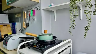 a pot on top of a stove in a kitchen at The Station Condo1 in Bangkok