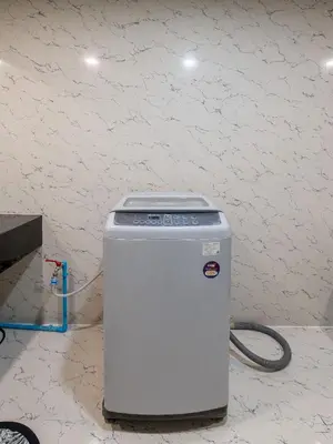 a white cpu sitting on the floor in a room at State tower High Floor City View Lovely Unit in Bangkok