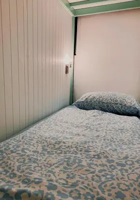 a bedroom with a bed in a room at The Hide Out Rambuttri Hostel in Bang Bua Thong Railway Station