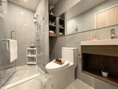 a bathroom with a toilet and a shower at Luxury 2BR︱Fast WiFi︱Walk to Central & MRT Rama 9 in Bangkok