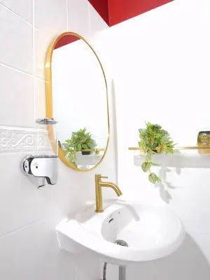 a bathroom with a sink and a mirror at Cozy House 2BR BTS Ekkamai in Bangkok