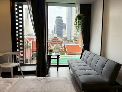 a bedroom with a couch and a large window at Cozy Mini Theatre - Victory Monument - 3 pax in Bangkok