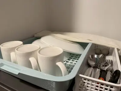 a plastic container filled with dishes and utensils at Cozy Mini Theatre - Victory Monument - 3 pax in Bangkok