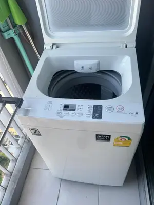 a washing machine is sitting on the floor at Cozy5Living in Bangkok 60m to MRT near chatuchank in Ban Bang Khwang