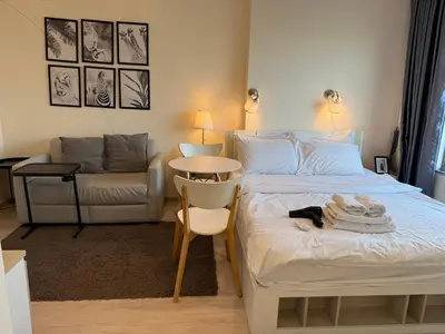 a bedroom with a bed and a chair and a couch at Cozy5Living in Bangkok 60m to MRT near chatuchank in Ban Bang Khwang