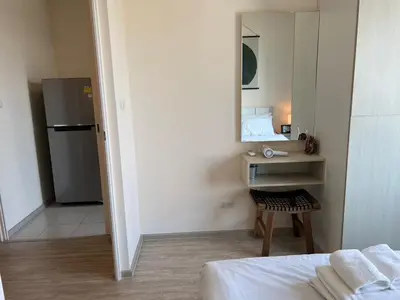 a small room with a bed and a mirror at Cozy8Living in Bangkok 60mto MRT in Ban Bang Khwang