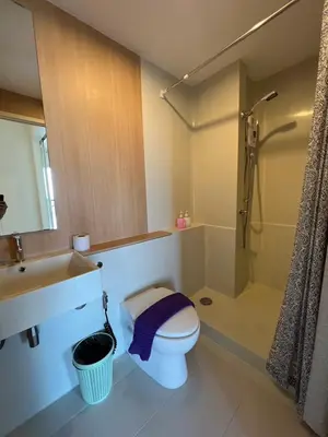 a bathroom with a toilet and a sink and a shower at Cozy8Living in Bangkok 60mto MRT in Ban Bang Khwang