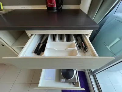a drawer in a kitchen with some knives at Cozy8Living in Bangkok 60mto MRT in Ban Bang Khwang