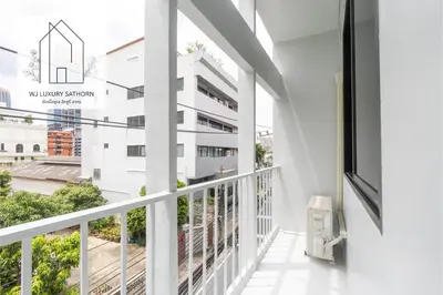 a balcony with a view of a building at WJ Luxury Sathorn in Bangkok