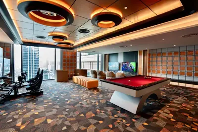a billiard room with a pool table in a building at Grande Centre Point Prestige Bangkok in Bangkok
