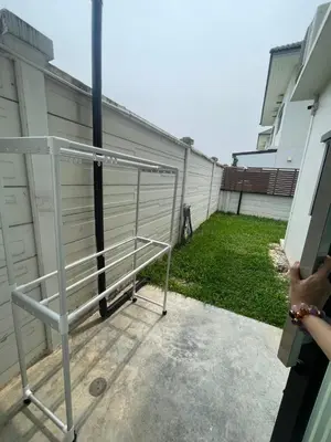 a metal fence in front of a building at Maxim in Pak Kret