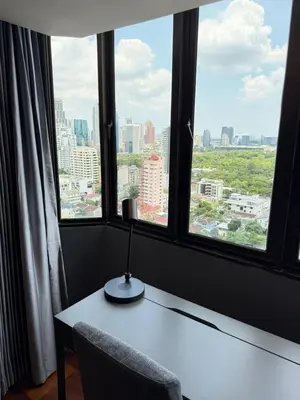a desk with a lamp in front of a window at Chic Bangkok Escape & Fast Wifi in Bangkok