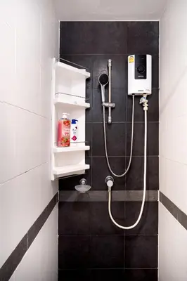a bathroom with a shower with a shower at A space by cream in Bangkok