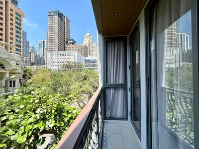 a balcony with a view of a city skyline at Klass Langsuan Condo in Bangkok