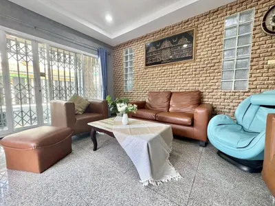 a living room with a couch and chairs and a table at 8Pax Spacious Private Home near The Mall Bangkapi in Ban Bang Toei (1)