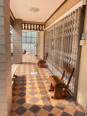 a hallway with two chairs and a checkered floor at 8Pax Spacious Private Home near The Mall Bangkapi in Ban Bang Toei (1)
