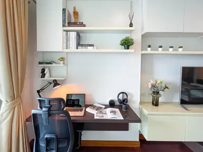 an office with a desk with a laptop and a chair at Near BTS Thong Lor l Workspace and Kitchen l Sontana in Bangkok