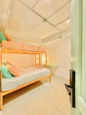 a bedroom with two bunk beds in a room at Lazy Sunday Khaosan Hotel in Bangkok
