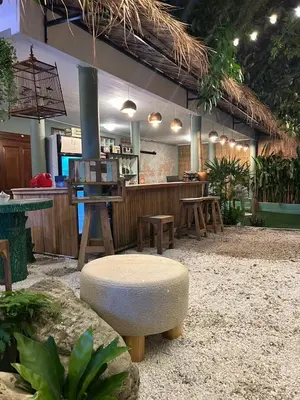 a restaurant with a bar with a bench and a table at The oasis on 8 Villa pool table & KTV in Bangkok
