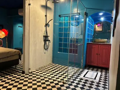 a bathroom with a shower with a glass door at The oasis on 8 Villa pool table & KTV in Bangkok