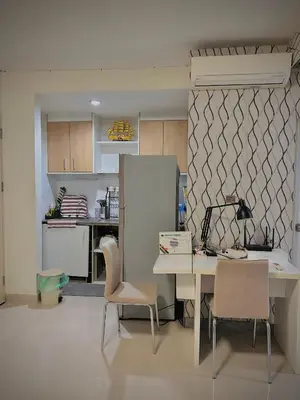a kitchen with a table and two chairs and a desk at Stylish Bangkok Condo Furnished, Pool View Prime Location in Bangkok