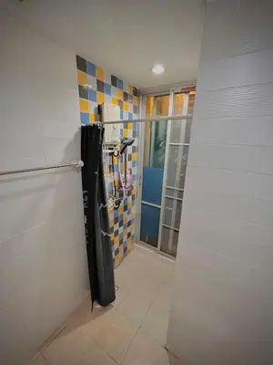 a bathroom with a punching bag in a room at Stylish Bangkok Condo Furnished, Pool View Prime Location in Bangkok