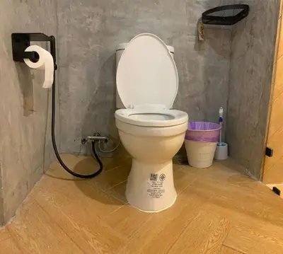 a bathroom with a toilet with a roll of toilet paper at Modern 59m Sukhumvit 1BR - 31st Floor Pool - Gym in Makkasan