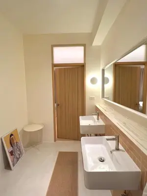 a bathroom with two sinks and a large mirror at Slaap36 5BR Home with Parking, Walk to BTS Ari in Bangkok