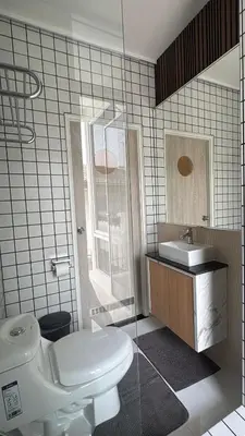 a bathroom with a toilet and a sink at BaanChan House and Studio at Ramkhamhaeng in Ban Bang Toei (1)