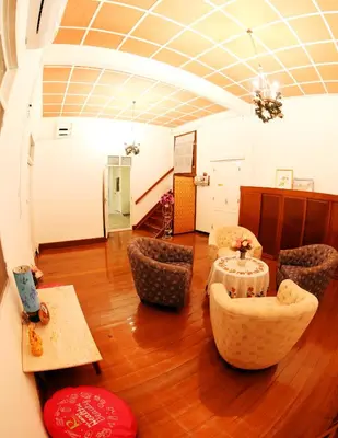 a room with chairs and a table in a room at The Myth - Sud Sathorn in Bangkok