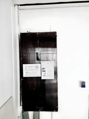 a black and white photo of a door of a refrigerator at Mitr Inn Khaosan Road - มิตรอินน์ ถนน ข้าวสาร in Bangkok