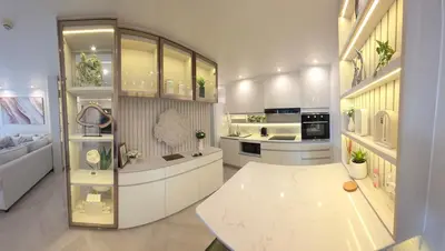 a large white kitchen with a table in it at Luxury Condo City Living R3 in Bangkok