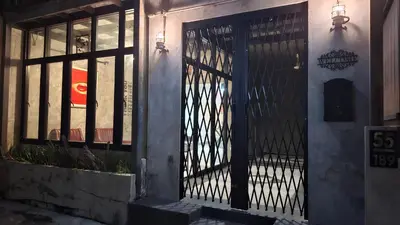 an iron gate on the side of a building at The Loft House Muangthong in Ban Bang Phang