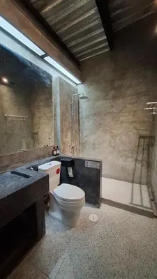 a bathroom with a toilet and a sink at The Loft House Muangthong in Ban Bang Phang
