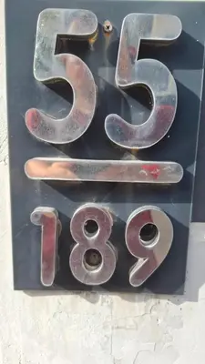 a metal sign with the number on it at The Loft House Muangthong in Ban Bang Phang