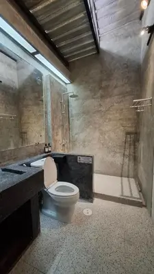 a bathroom with a toilet and a sink and a shower at The Loft House Muangthong in Ban Bang Phang