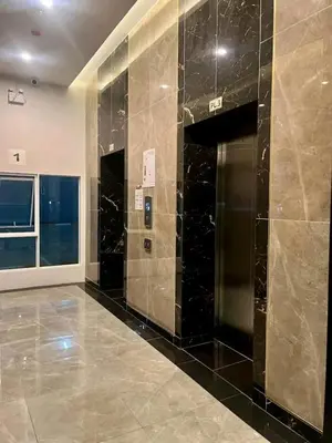 a lobby with black marble walls and a elevator at Life city 1 in Bang Chak