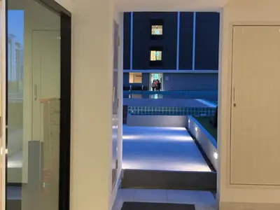 a hallway of a building with blue cabinets at Life city 1 in Bang Chak