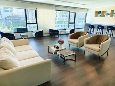 a living room with couches and chairs and a table at Life city 1 in Bang Chak