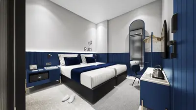a blue and white bedroom with a bed and a sink at ARNI HER Ladies Hotel - Female Only in Bangkok