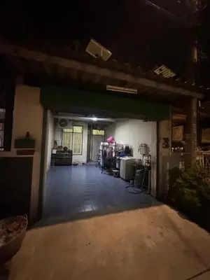 a dark room with a garage at night at Homestay in Tha Akatsayan Don Muang