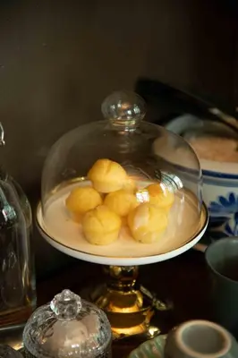 a plate of food in a glass dish on a table at Casa Acero in Bangkok