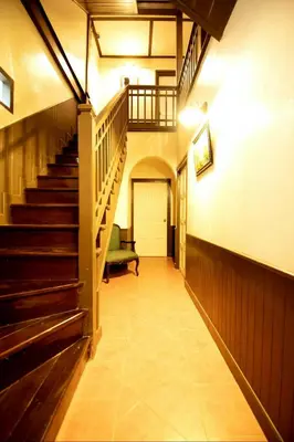 a hallway with a staircase in a building at Casa Acero in Bangkok