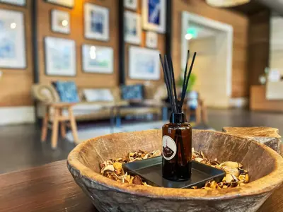a bottle in a bowl on top of a table at Walk to BTS Ekkamai l Urban Sukhumvit Living l Fast WiFi in Bangkok