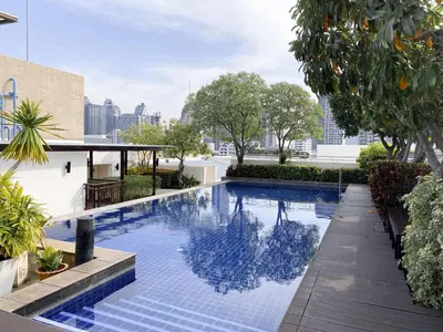a swimming pool in the middle of a building at Contemporary 53 SQM - BTS Thong Lo - Ultra Fast WiFi in Bangkok
