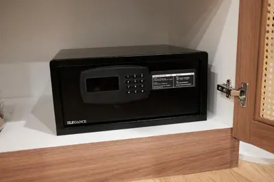 a microwave oven sitting on top of a shelf at The Shantipan Jasmine - Cozy City Retreat 400m from BTS Station in Bangkok