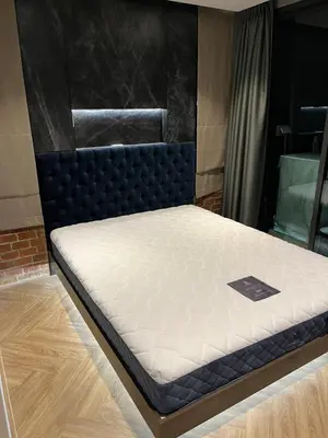 a mattress on a bed frame in a room at Spaceous Appartment on Sukhumvit in Bangkok