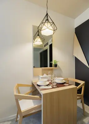 a dining room table with two chairs and a mirror at Relaxing place in Downtown, BKK in Bangkok