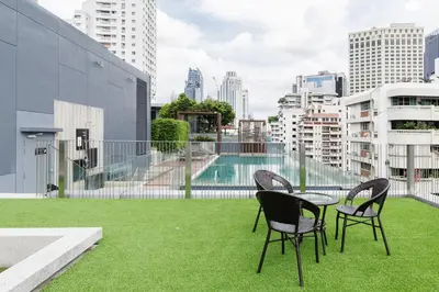 a table and chairs on the roof of a building at Relaxing place in Downtown, BKK in Bangkok