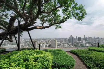 a view of the city from the top at Panoramic 2BR Ekkamai with infinity pool in Bangkok
